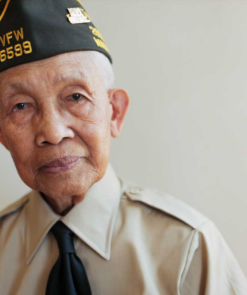 A World War II Veteran take a moment to have his picture taken on Veterans Day A WWII Veteran looking at the camera