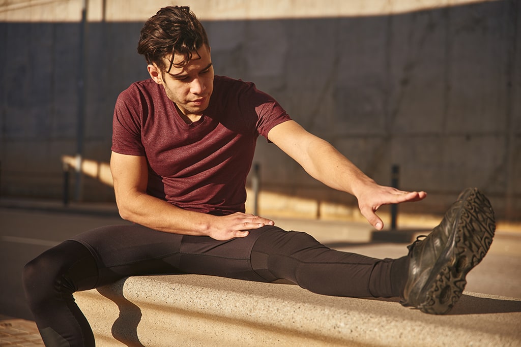 Man Stretching Outside