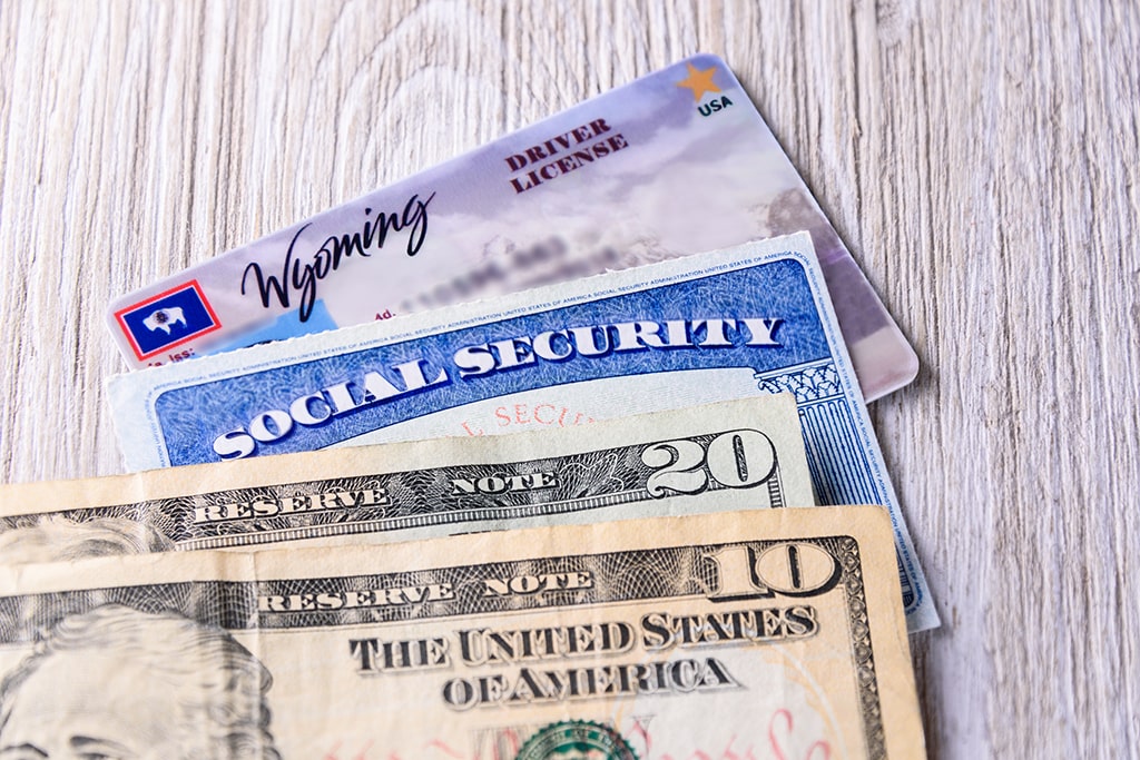 Wyoming driver's license, social security card, and cash.