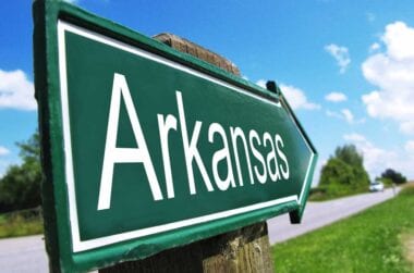 Green Arkansas Road sign.