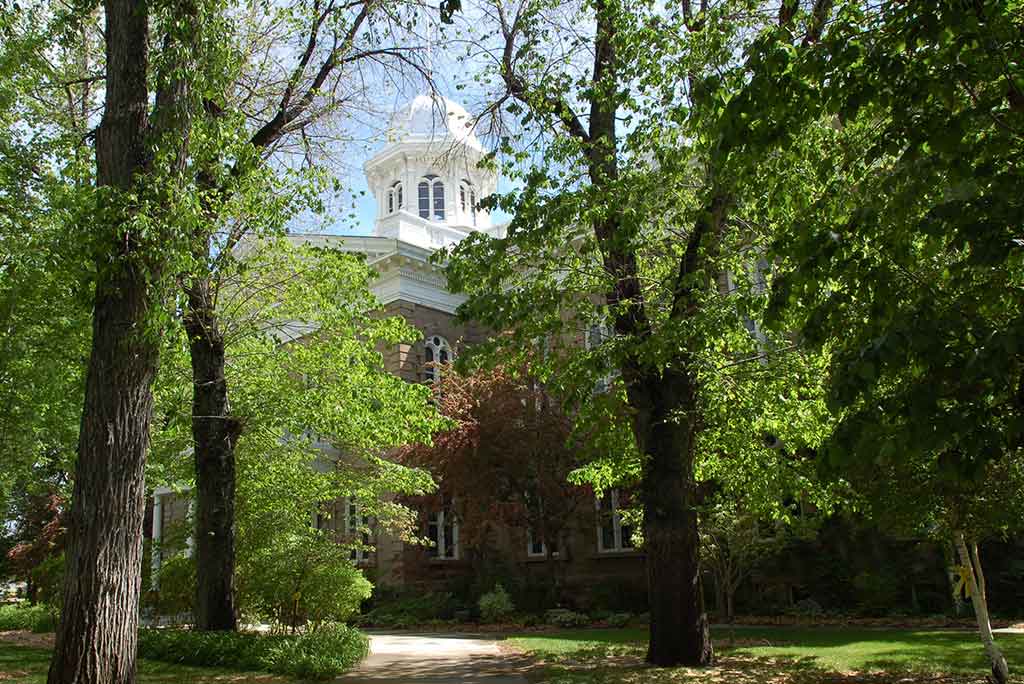 Nevada building with green trees in front.