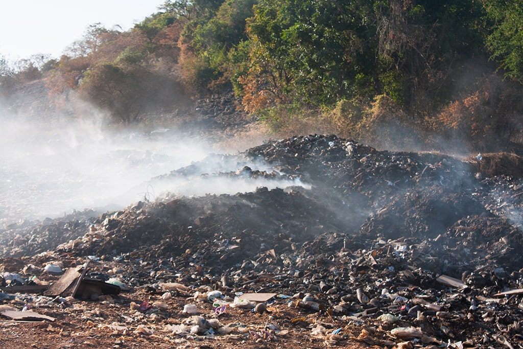 Image of a smoldering burn pit.