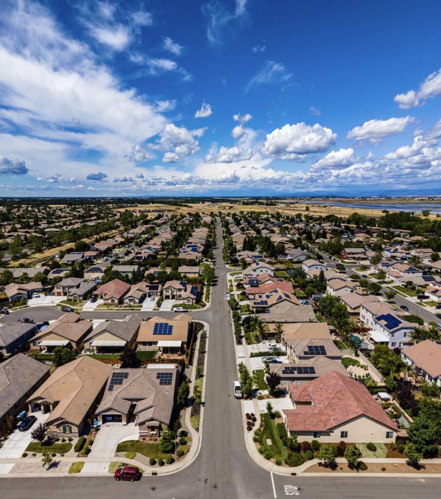 California housing subdivisions with a blue sky above.