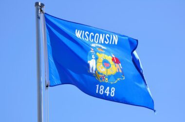 WISCONSIN State flag flying.