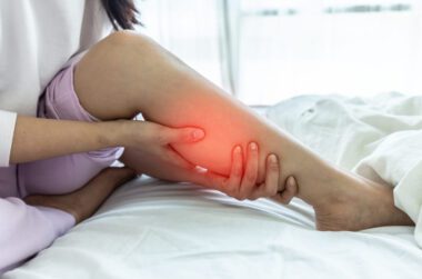 Restless Legs Syndrome image of woman holding her leg.