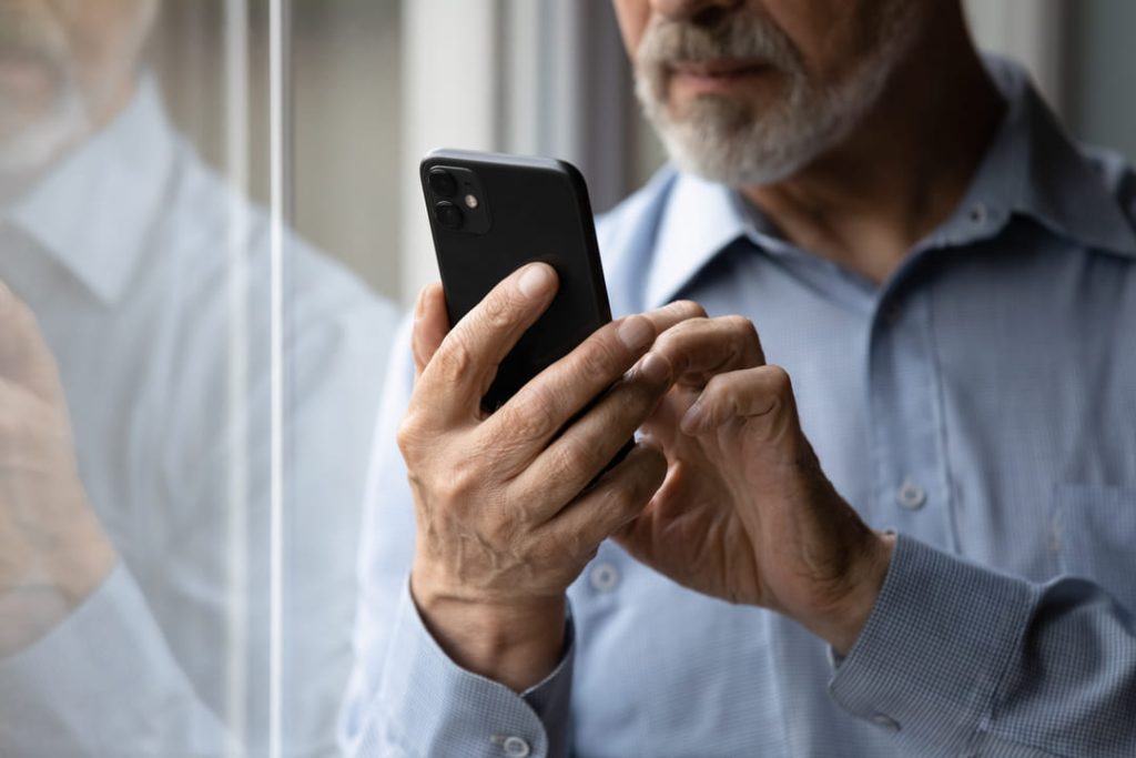 Man looking at his cell phone.