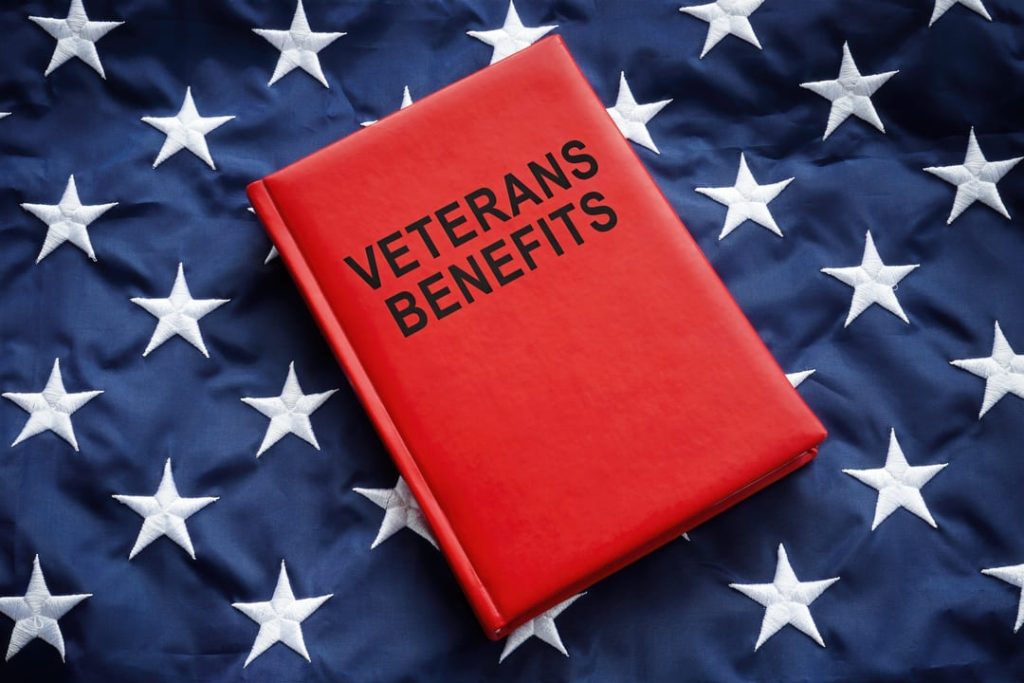 Veteran Benefits Book On Top of An American Flag 2