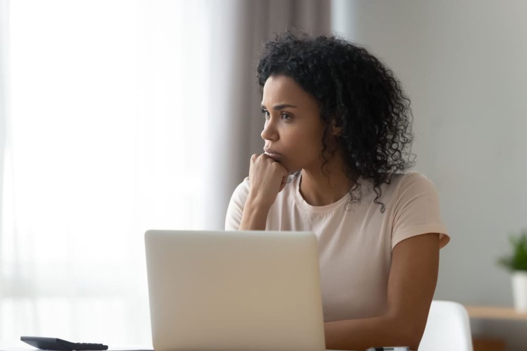 WOMAN AT COMPUTER GETTING READY TO FILE VA UNEMPLOYABILITY FORM