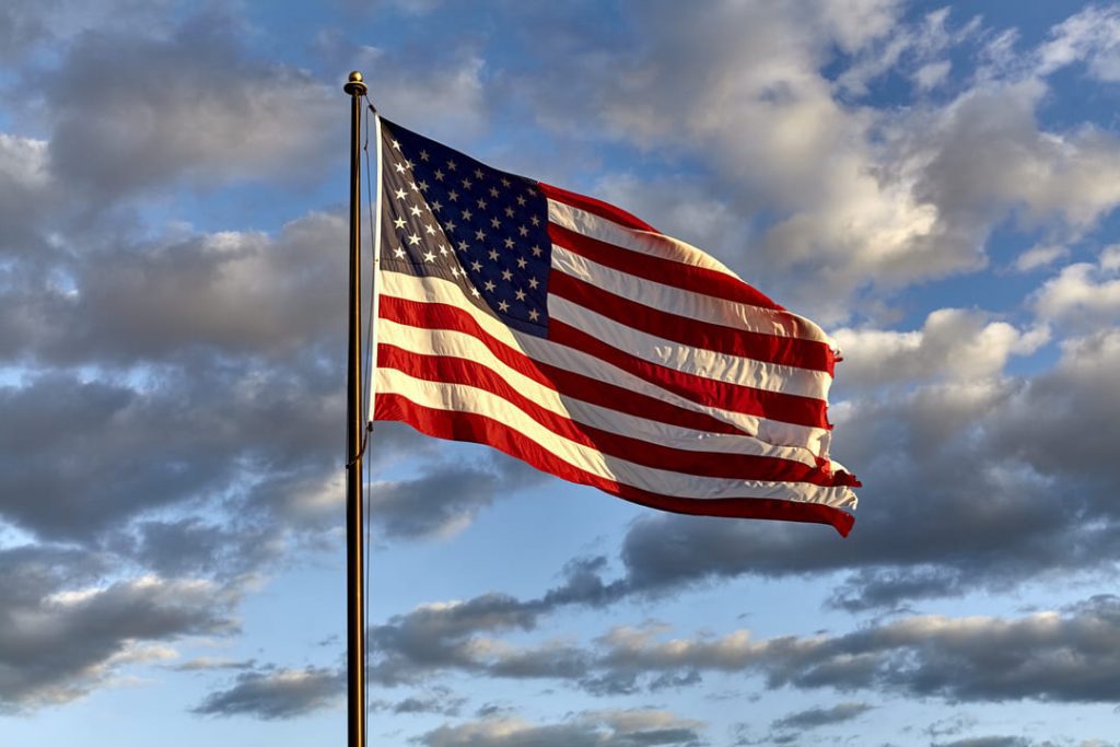 American flag flying at sunset.