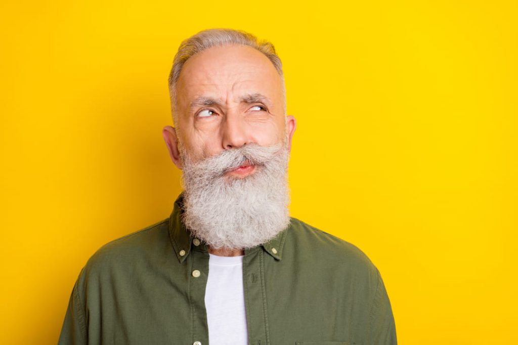 Bearded man with a quizzical look on his face.