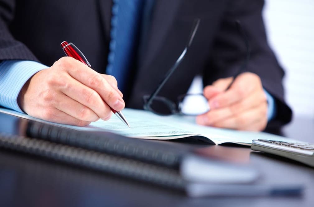 Man filling out a form.