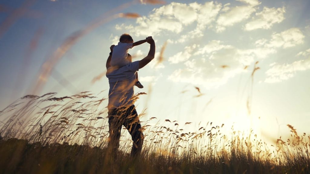 MAN WITH SUN ON HIS SHOULDERS