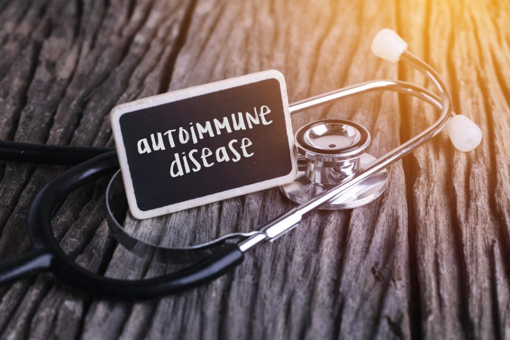 Autoimmune disease sign on top of a stethoscope.