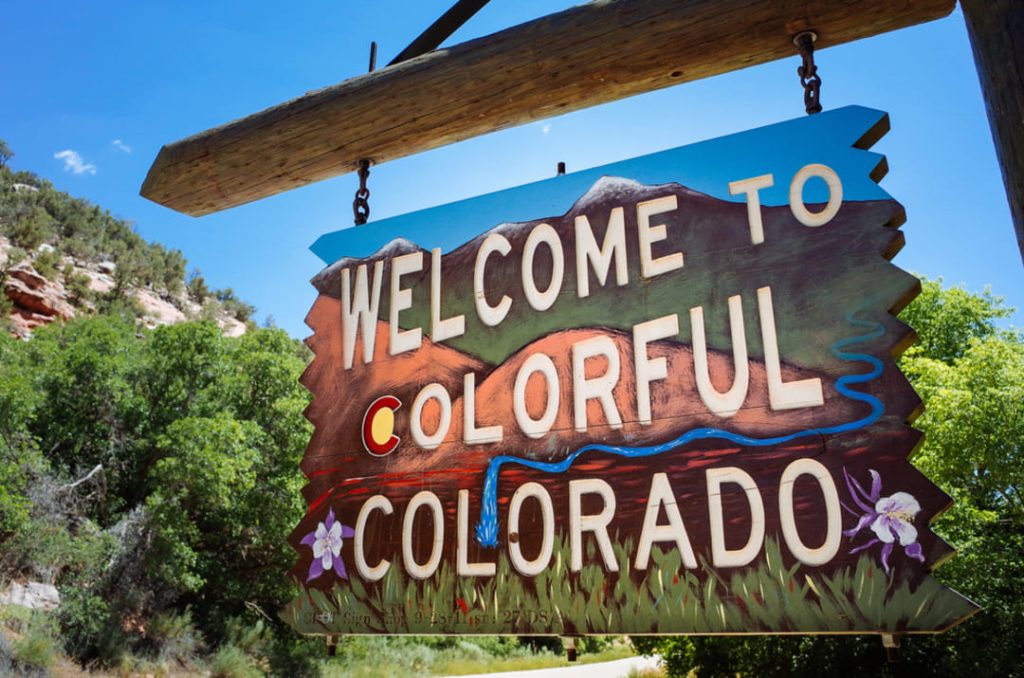 Welcome to Colorado colorful wooden road sign.