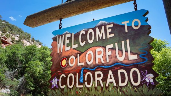Welcome to Colorado colorful wooden road sign.