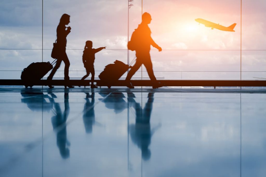 Familiy walking through airport.