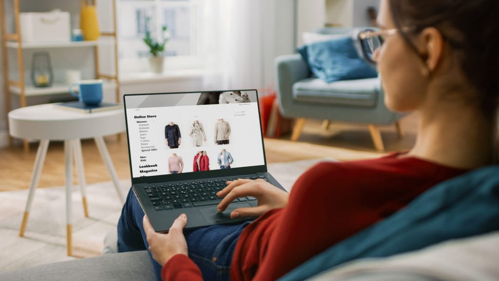 WOMAN ONLINE SHOPPING FOR CLOTHING.