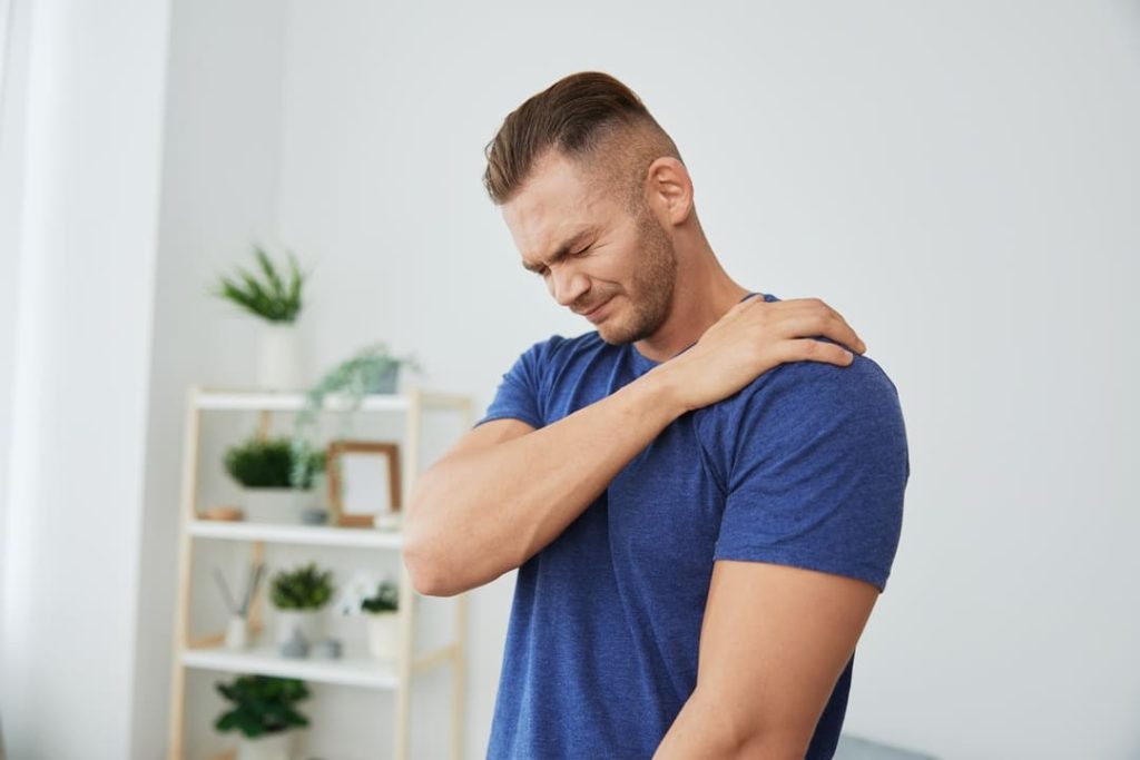 Man suffering from shoulder bursitis.