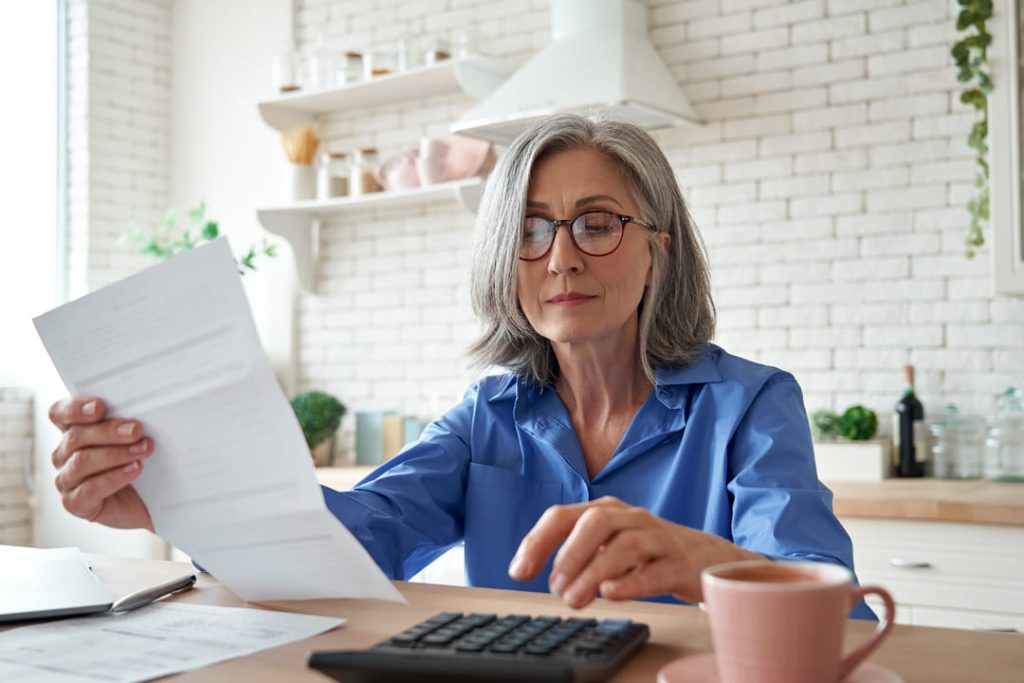 Woman looking at paperwork.