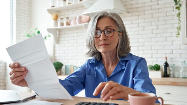 Woman looking at paperwork.